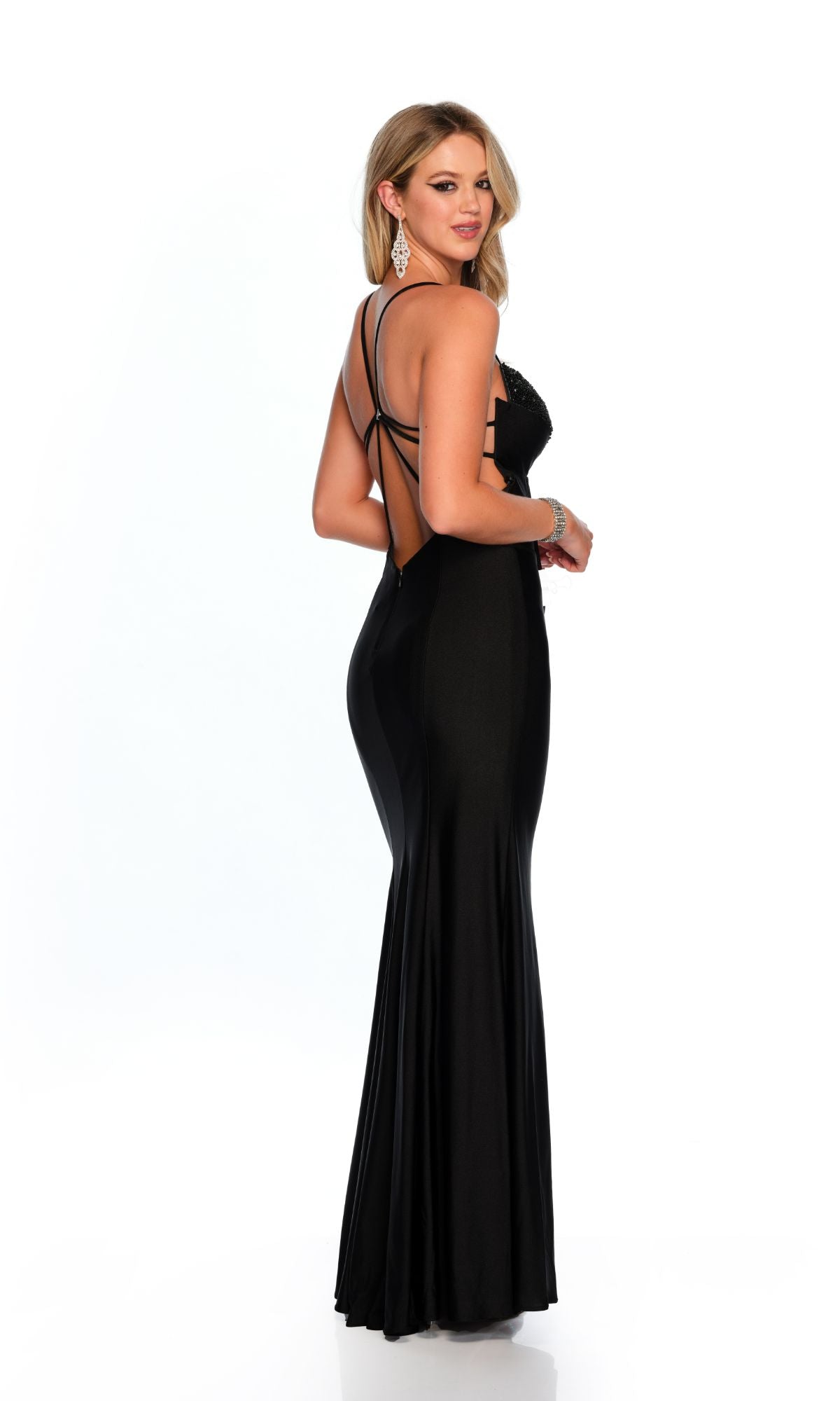 A woman models the Long Formal Dress 11601 by Dave and Johnny, featuring a fitted silhouette, cut-out sweetheart neckline, and strappy open back against a plain white background.